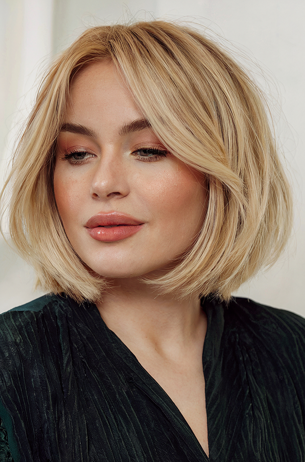 Soft Blonde Bob with Curtain Bangs face framing bangs hairstyle