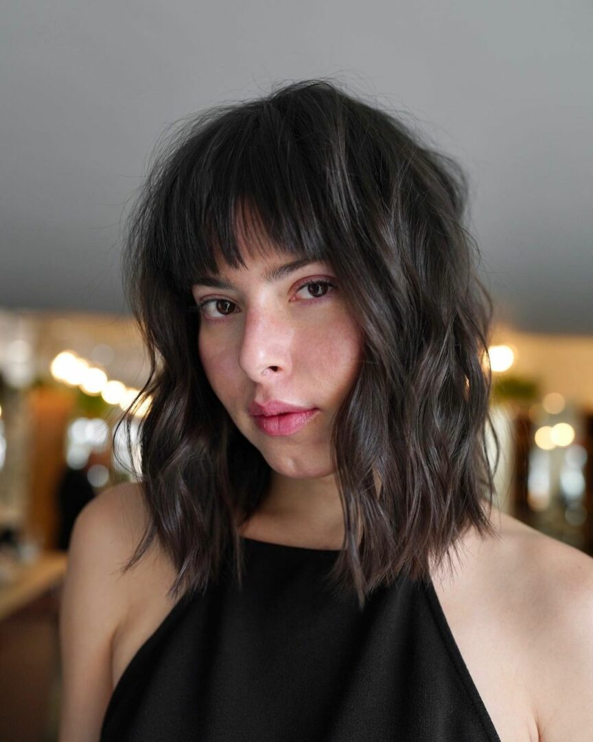 Chin bob with blunt bangs and natural wave low maintenance haircut