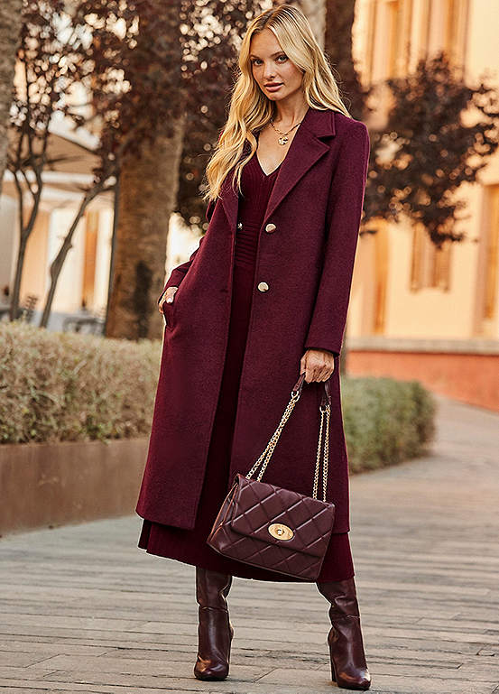 Woman in a burgundy longline wool coat