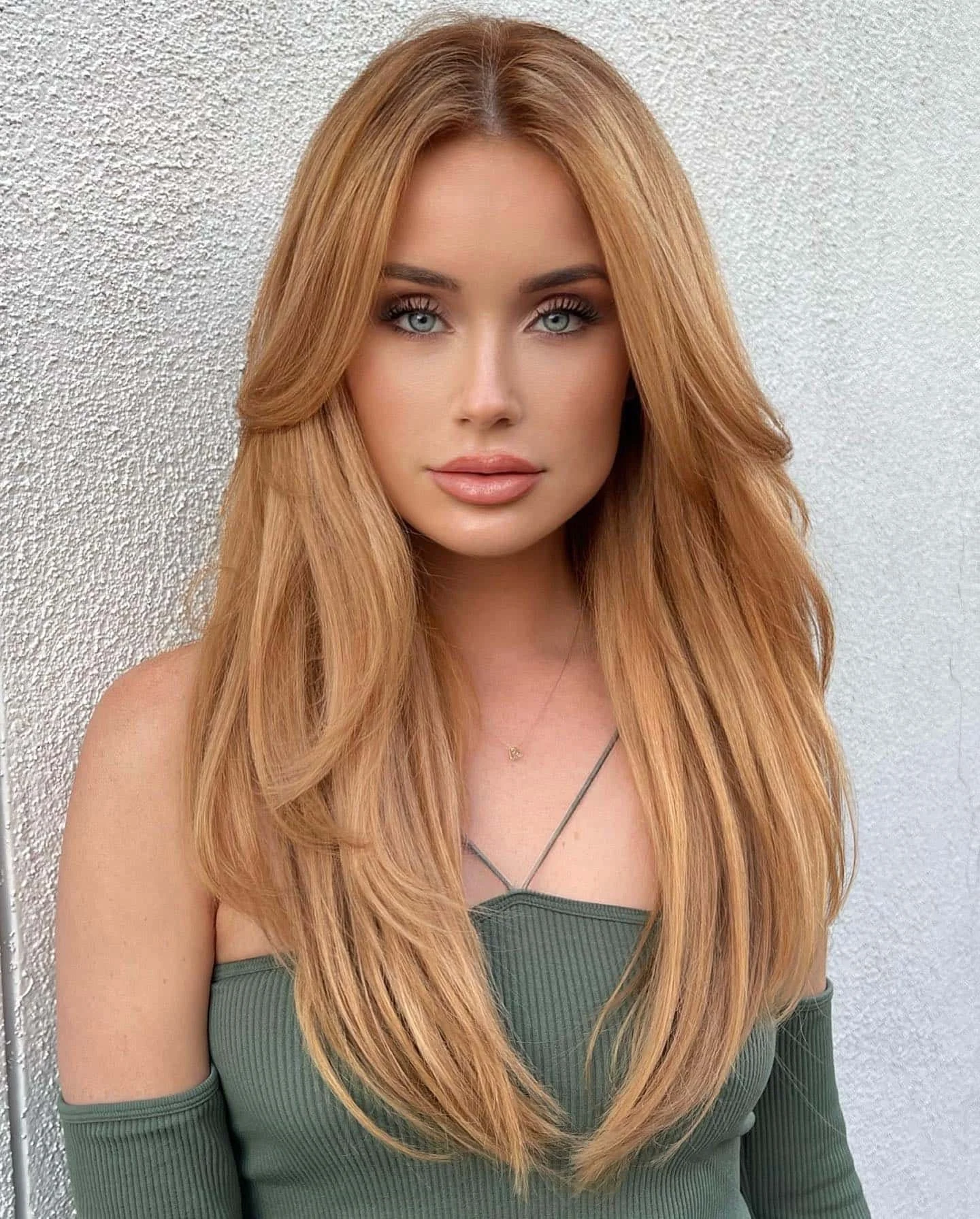 Strawberry blonde hair with soft highlights