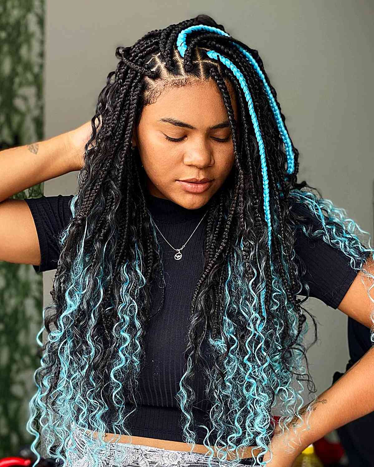 Box braids with teal highlights hairstyle