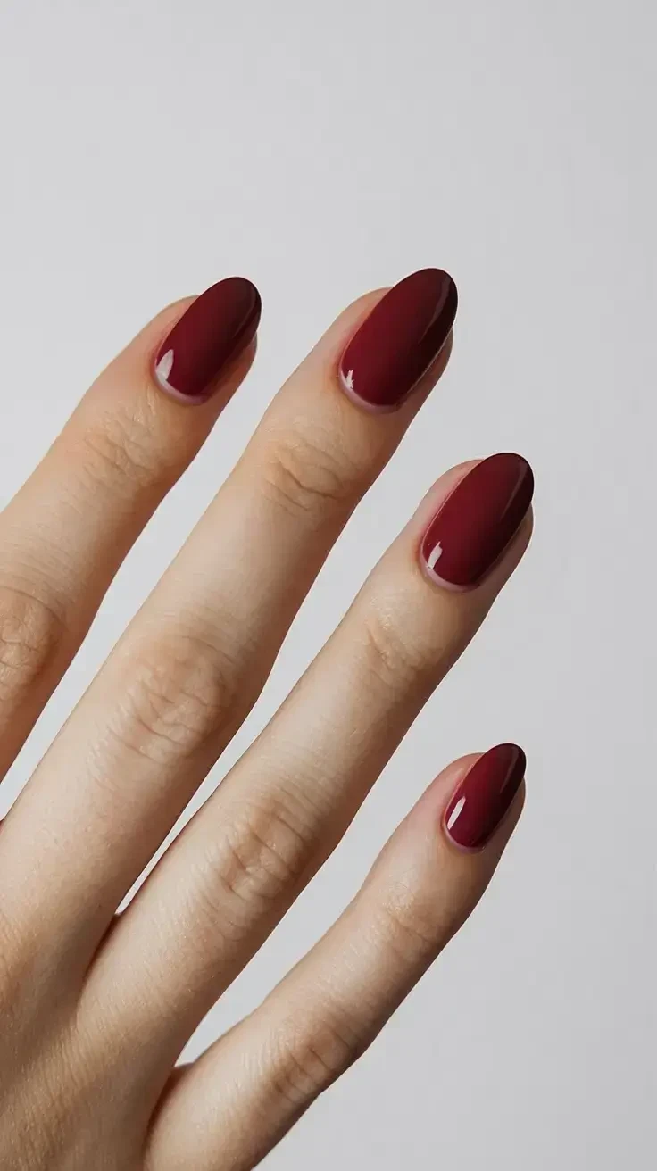 Deep Glossy Oxblood on a Medium Oval Shape red nail design