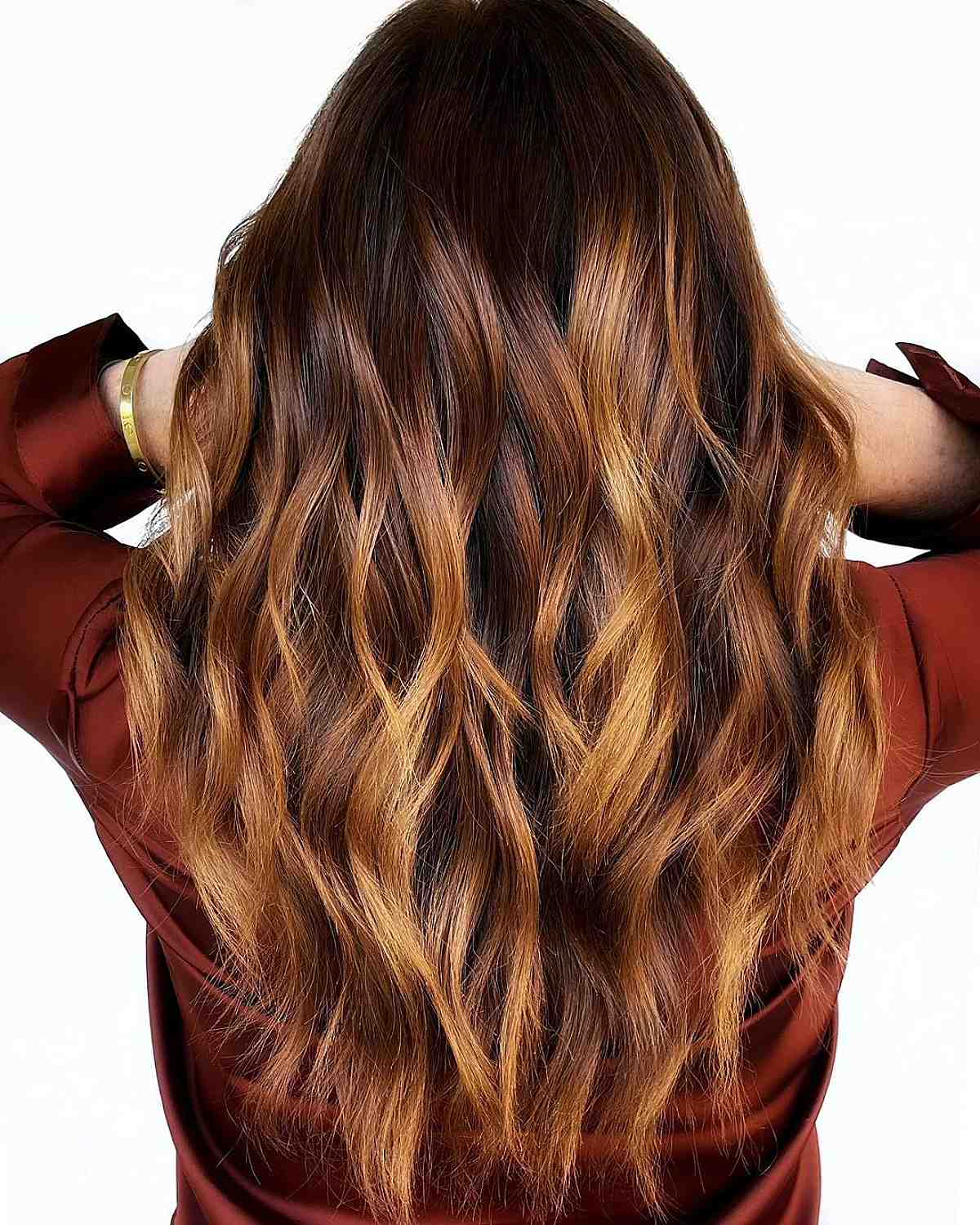 Sun-kissed caramel melt on dark brown hair