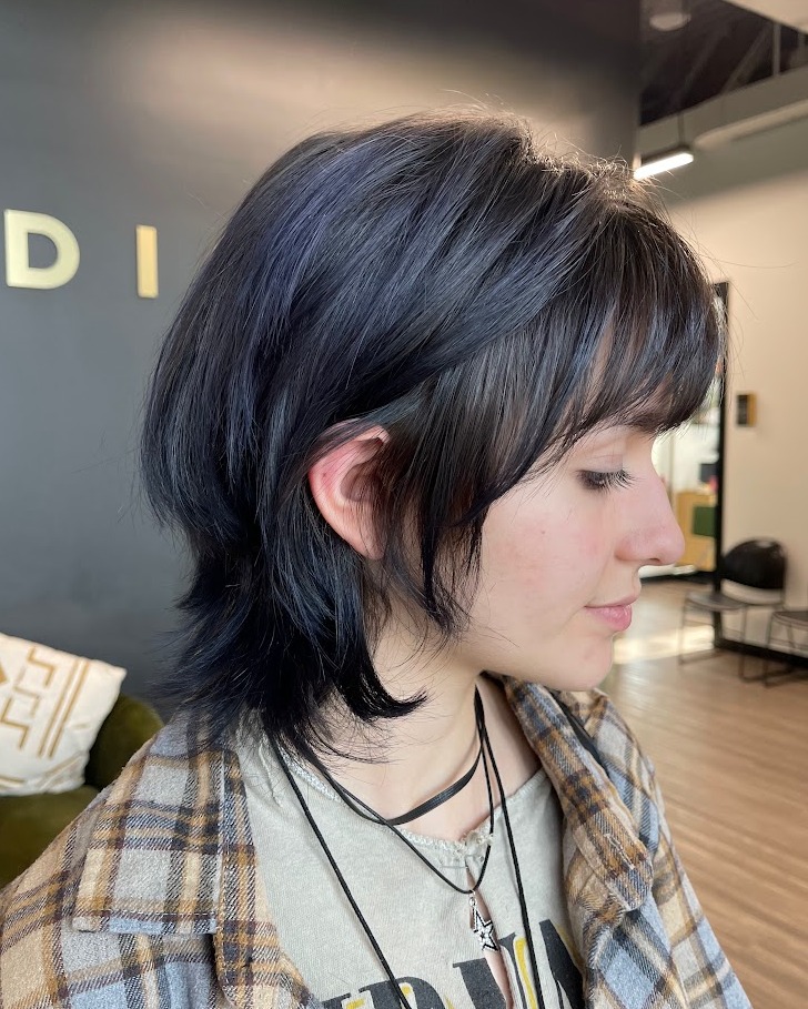 Short wolf cut with flipped nape and wispy fringe
