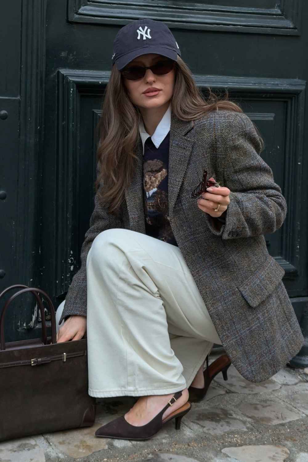 Tweed blazer with cream trousers and a baseball cap preppy outfit