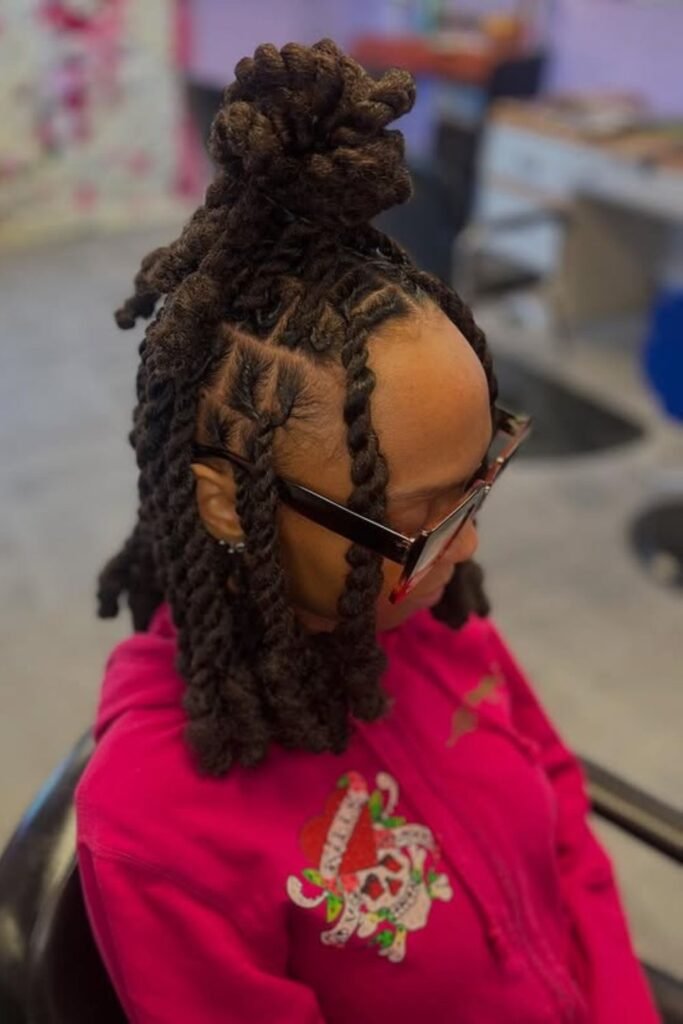 Top knot of two strand twists with the rest hanging loose