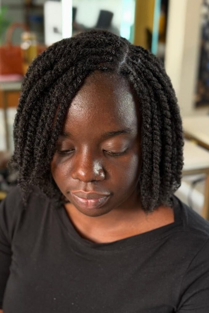 Short bob two strand twists with a clean side part