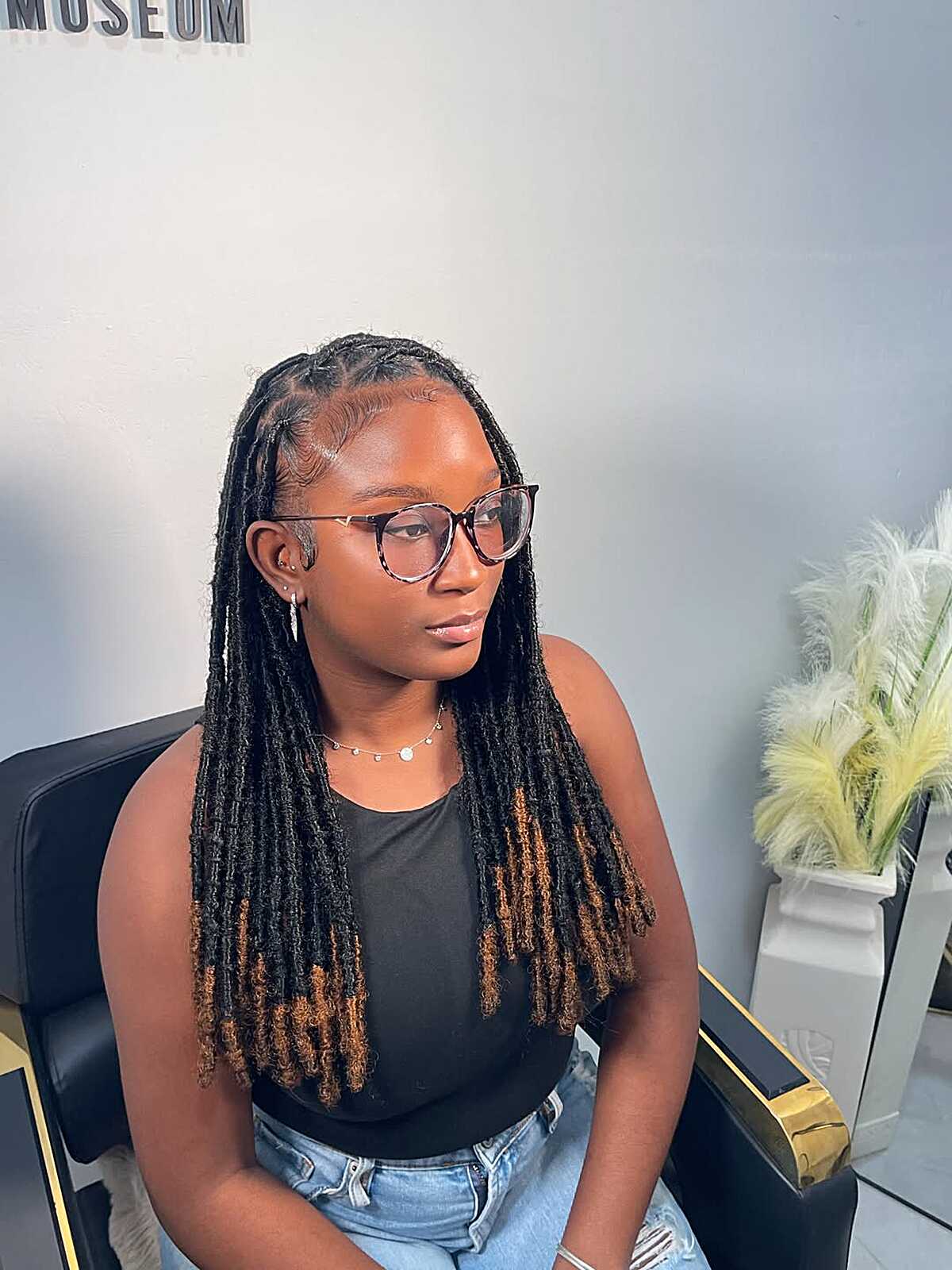Two-tone faux locs with honey brown tips