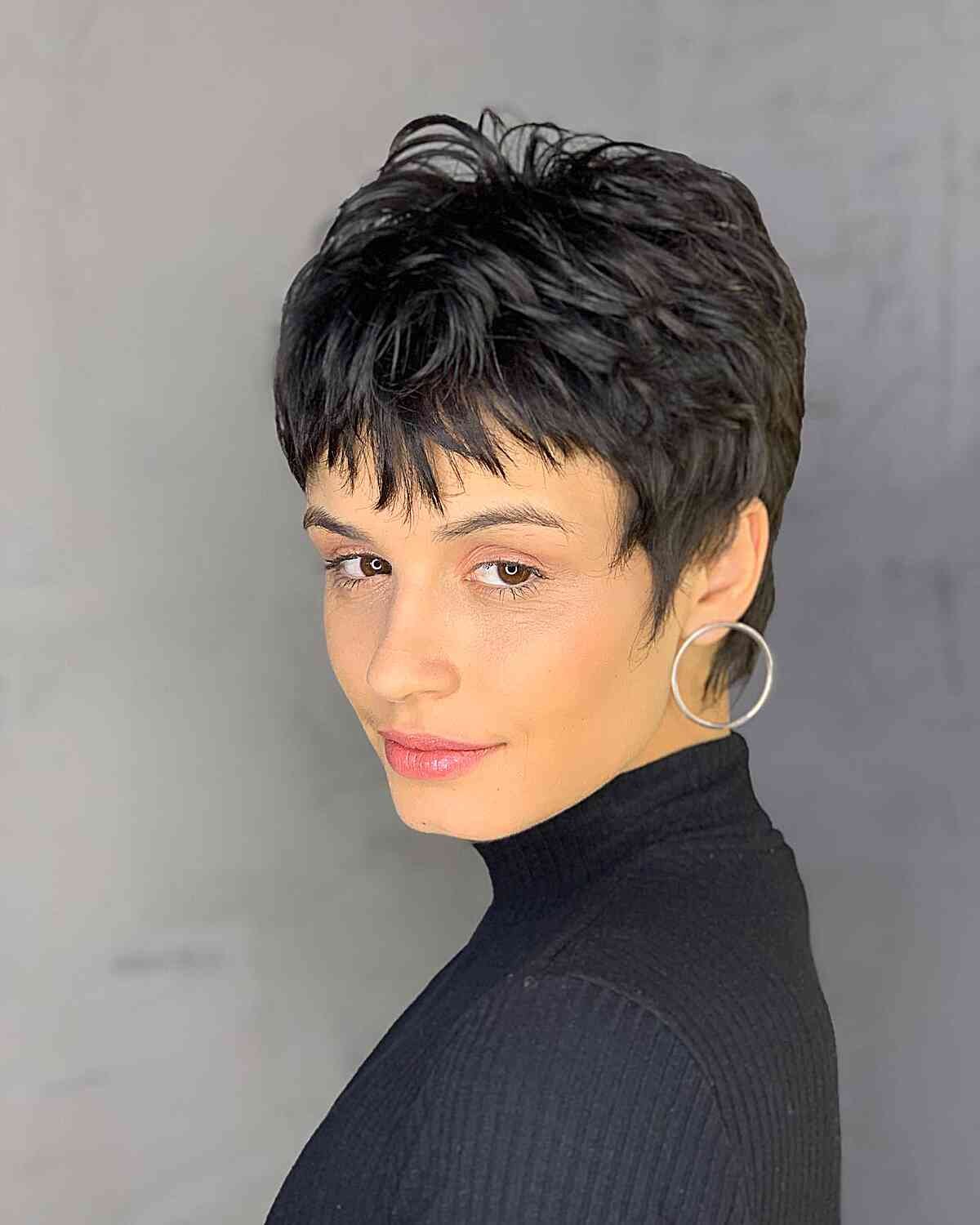 Woman with a spiky 90s pixie haircut with piecey layers