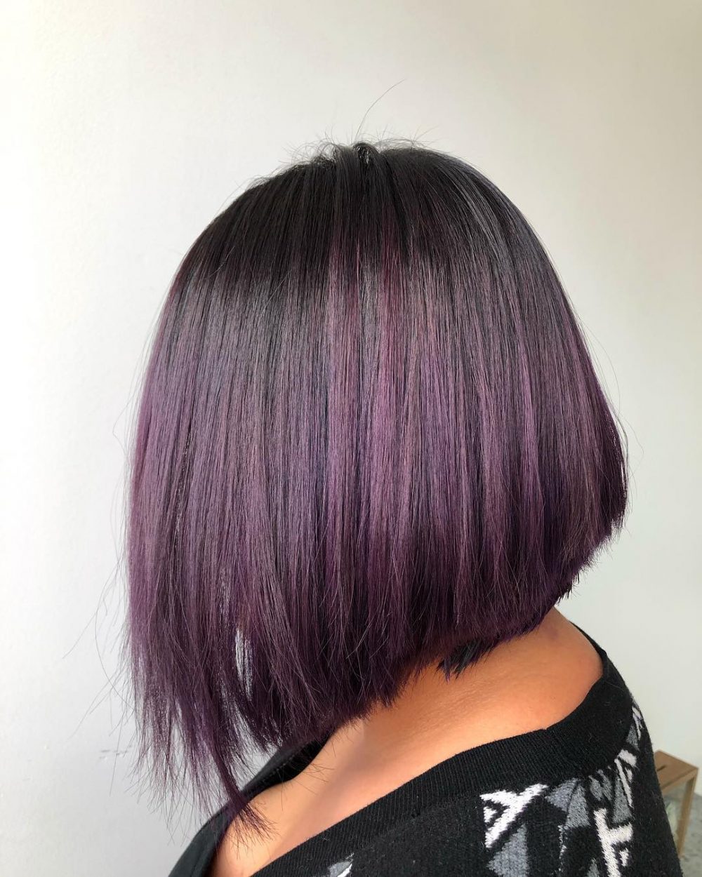 Violet plum hair color on a short lob haircut