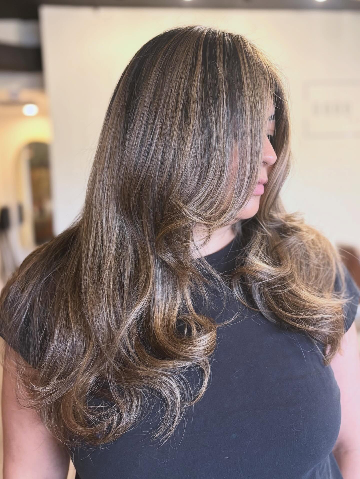 Honey Blonde Collarbone Waves with Curtain Bangs hairstyle