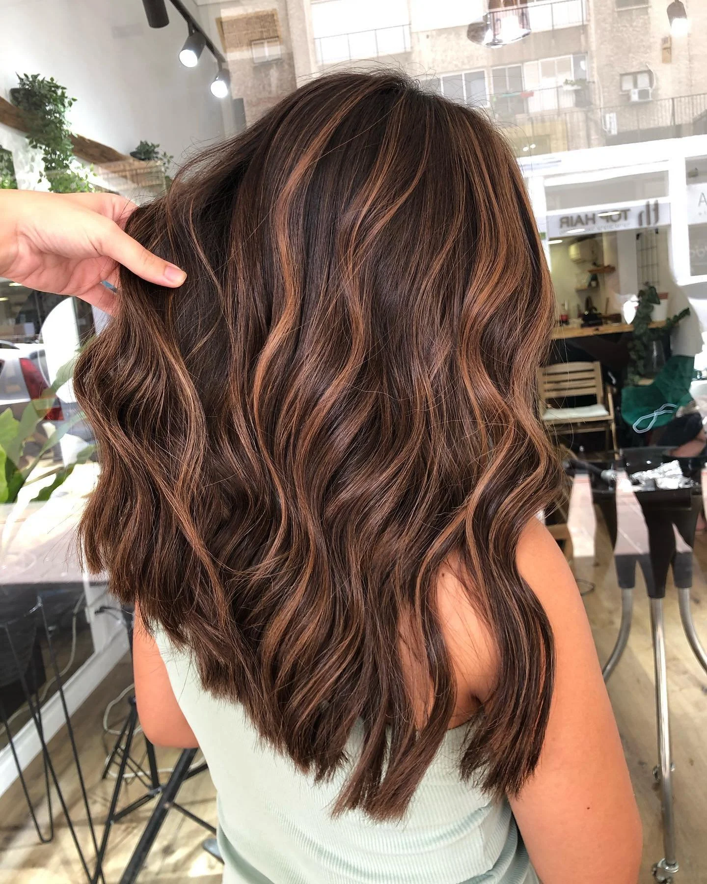 Warm-toned balayage blending brown, gold and red