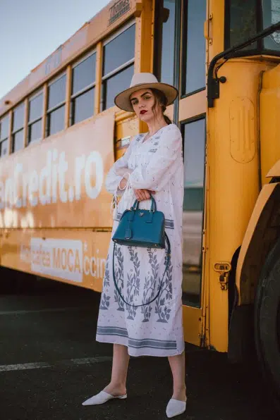 White mules with a white embroidered midi dress